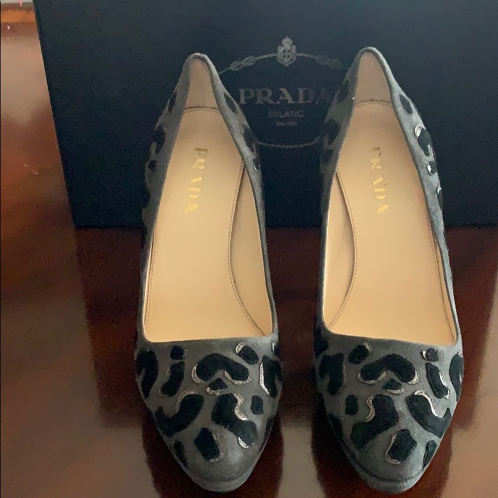 Prada leopard print pumps.  Never been worn.